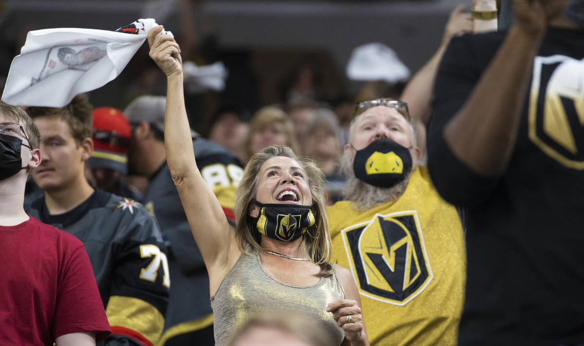 Golden Knights fans cheer for Vegas during Game 7 of the an NHL Stanley Cup first-round playoff ...