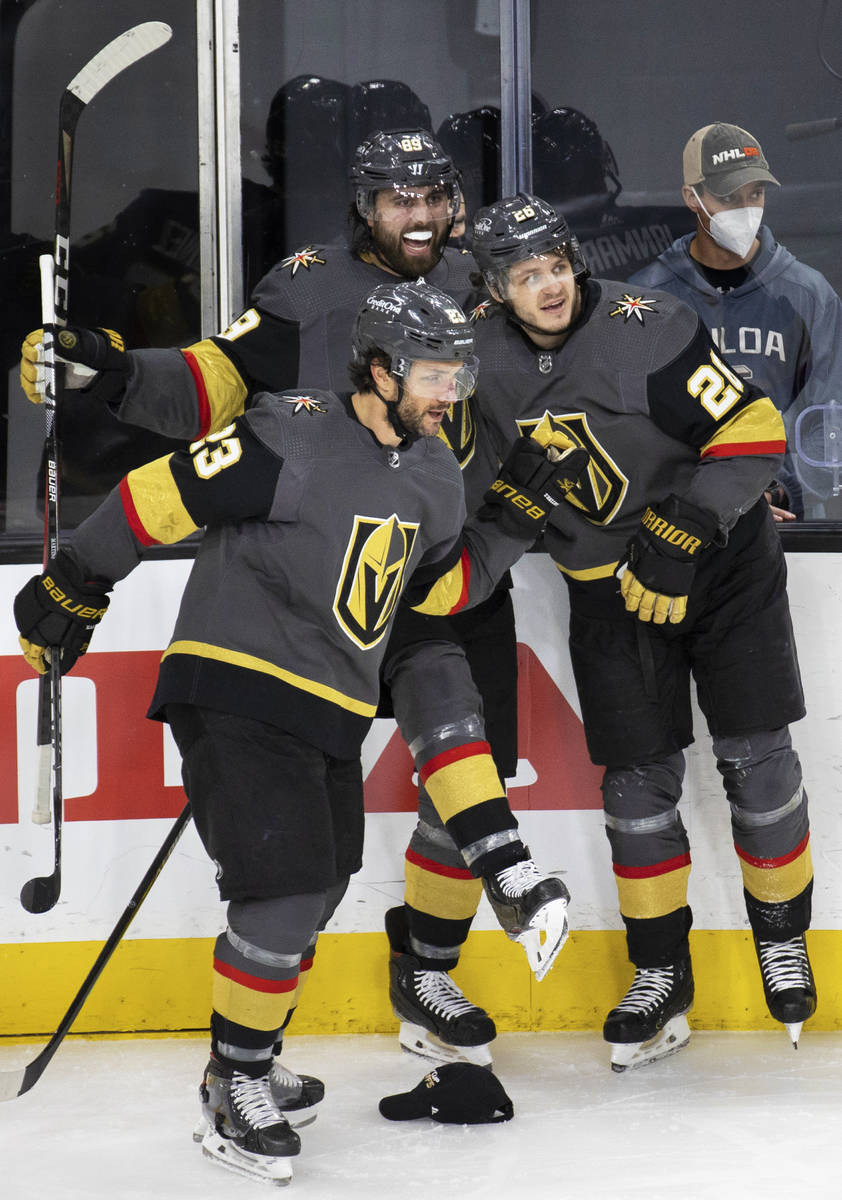 Vegas Golden Knights right wing Alex Tuch (89) and Vegas Golden Knights defenseman Alec Martine ...