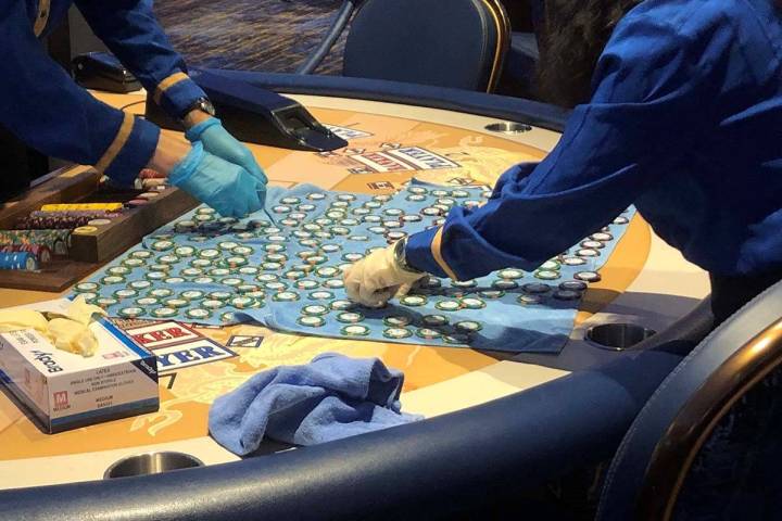 Workers at the Strat clean chips as the casino reopens on Thursday, June 4, 2020. (Katelyn Newb ...