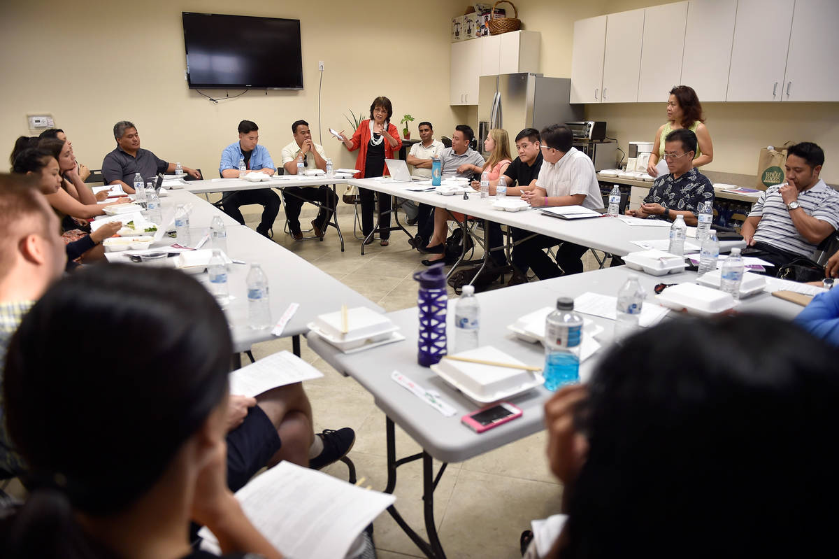 Rozita Lee, center, of the National Federation of Filipino American Associations speaks during ...