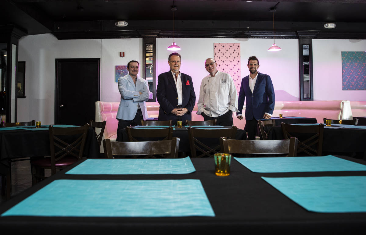 Chef David Robinson, owner of The Nevada Room, third from left, poses with, from left, vice pre ...