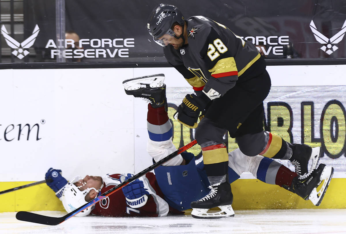 Colorado Avalanche's Joonas Donskoi (72) gets taken down to the ice by Golden Knights' William ...