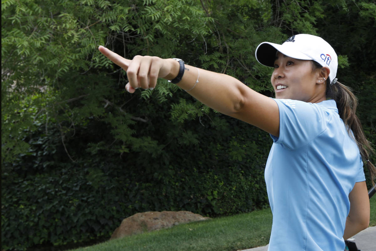 Danielle Kang gestures after finishing the 18th hole during the fourth round of the Bank of Hop ...