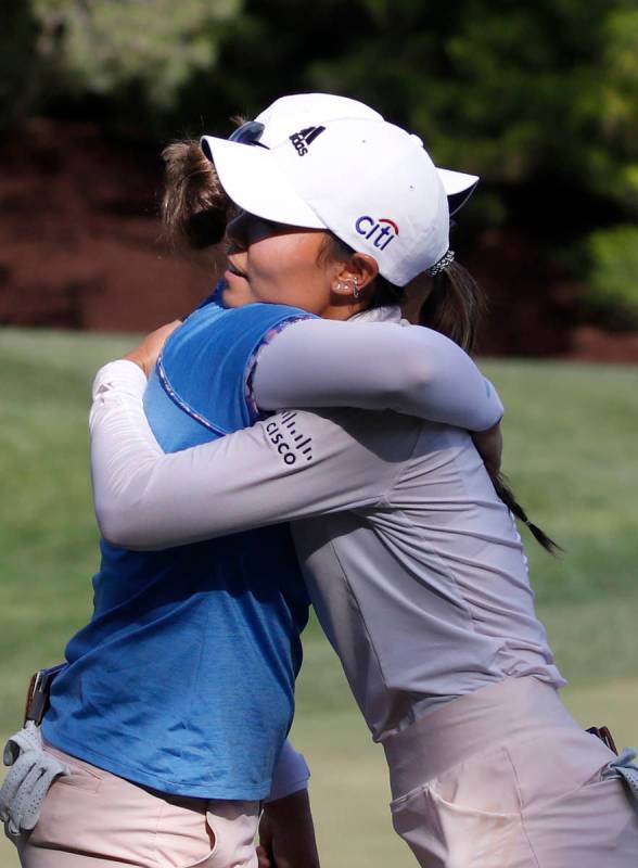 Danielle Kang, right, hugs Ally Ewing after finishing on the 18th hole during the quarter final ...