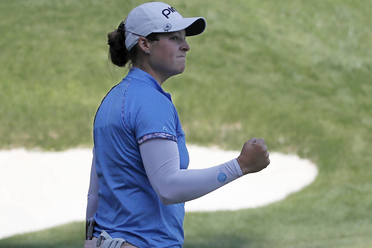 Ally Ewing reacts after finishing on the 18th hole during the quarter final round of the Bank o ...