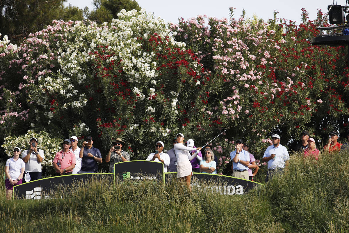 Danielle Kang, center, tees off on the 17th hole during the quarter final round of the Bank of ...