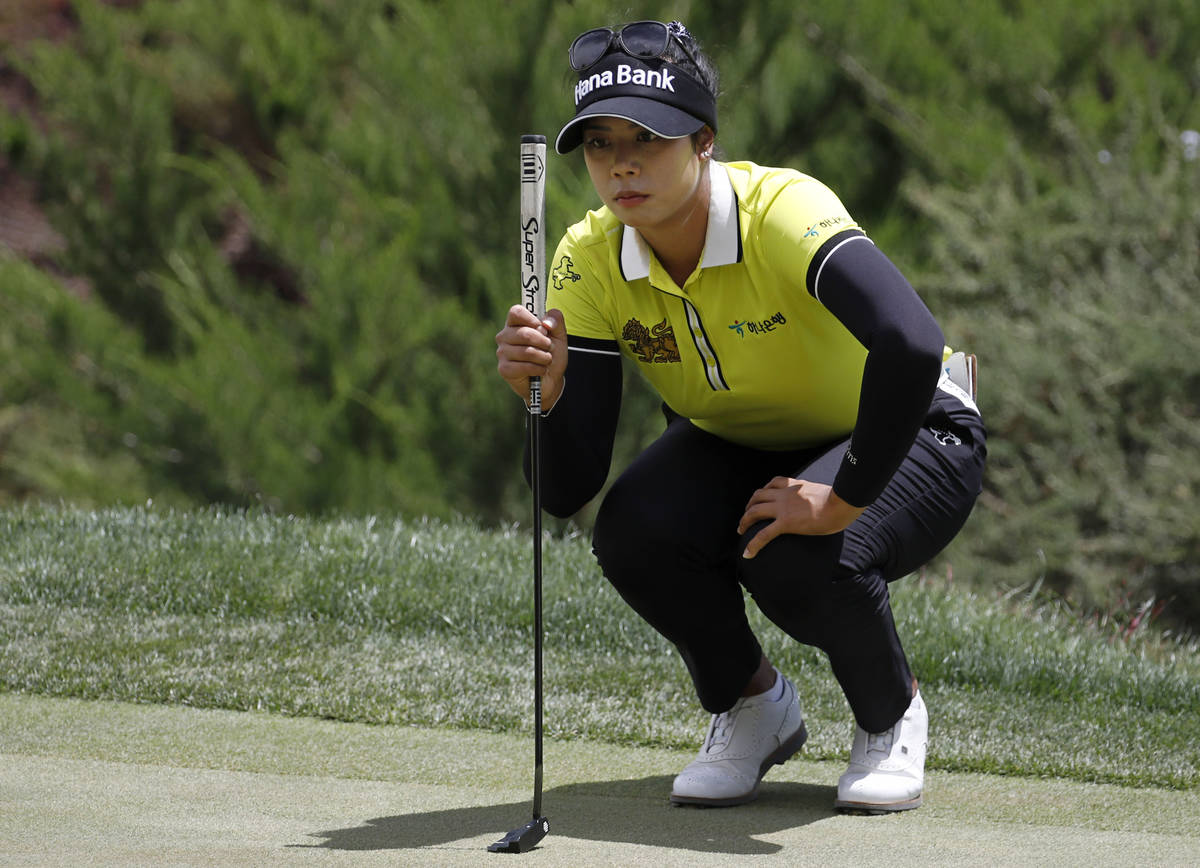 Patty Tavatanakit lines up a putt on the first green during the quarter final round of the Bank ...