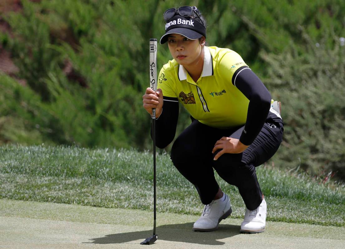 Patty Tavatanakit lines up a putt on the first green during the quarter final round of the Bank ...