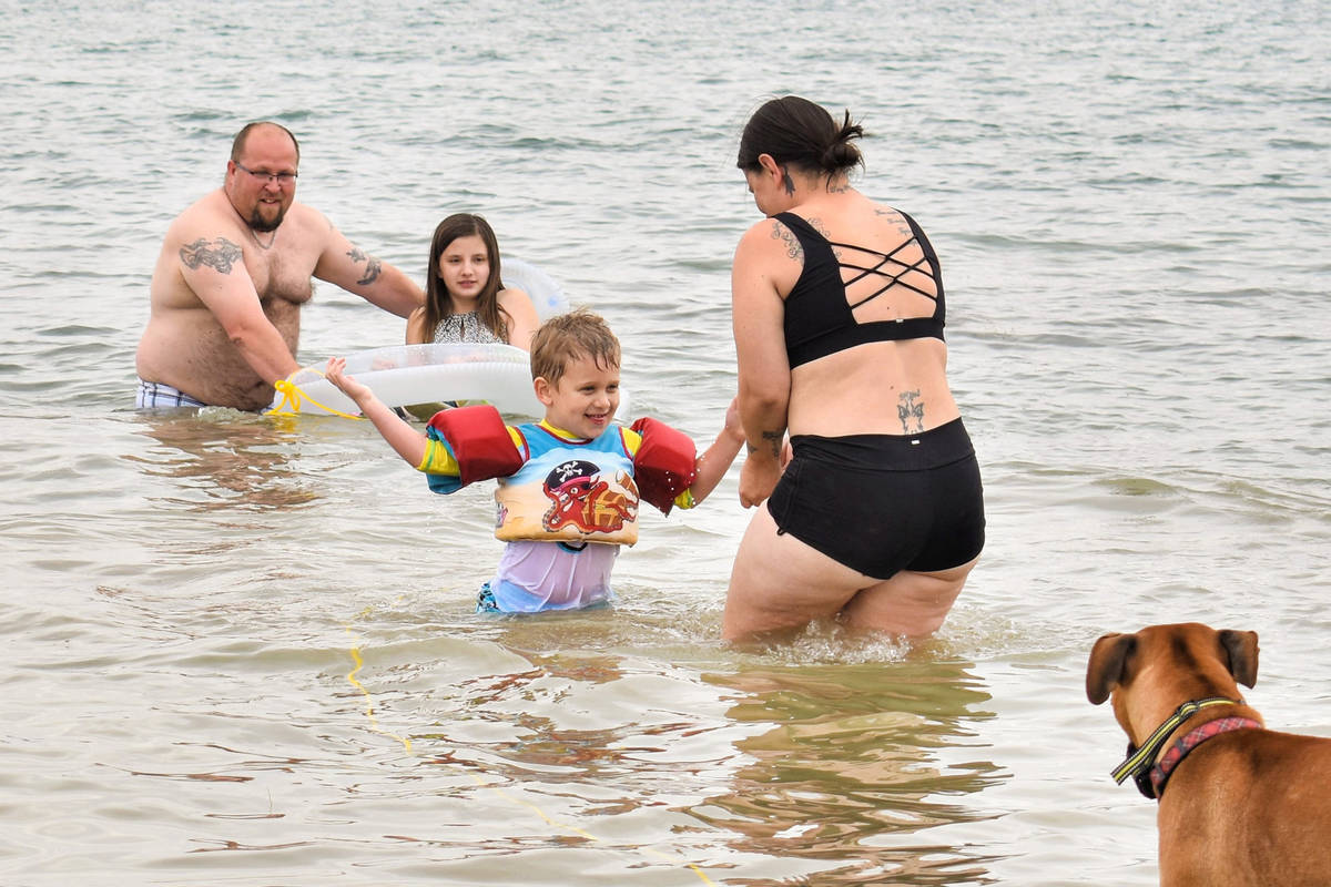 Jaxon Huls, 4, of Las Vegas plays with Kim Price, as John Huls and Josilyn Price, 12, look on a ...