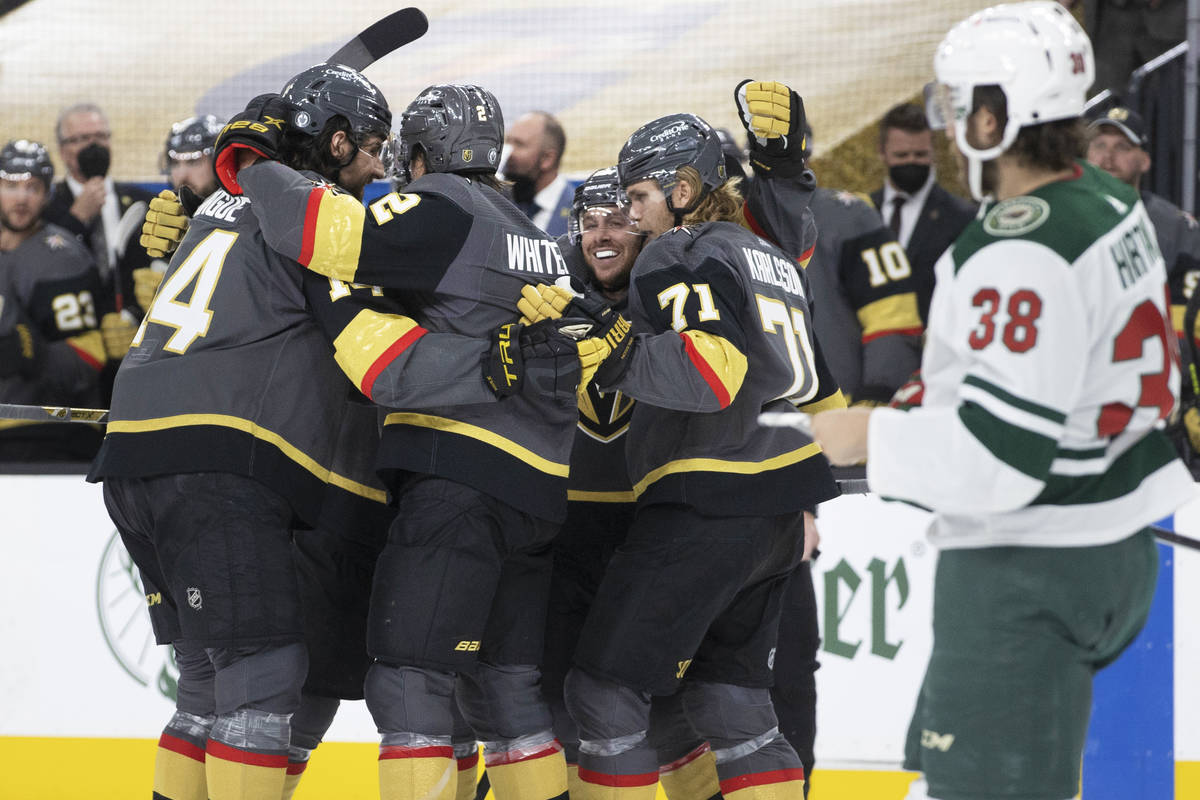 Vegas Golden Knights players celebrate after a second-period goal in game 7 of the an NHL Stanl ...