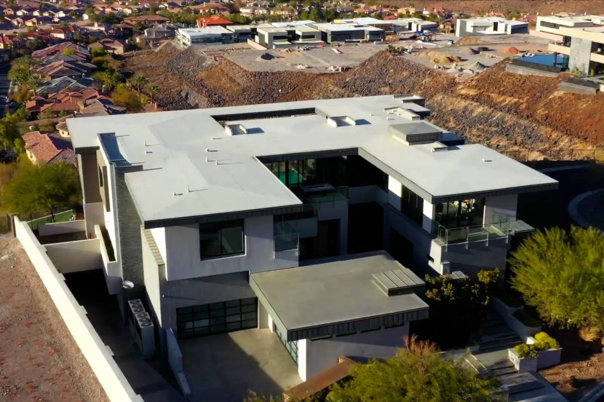 Rock star Gene Simmons of Kiss has paid a combined $10.8 million for a home in the Henderson hi ...