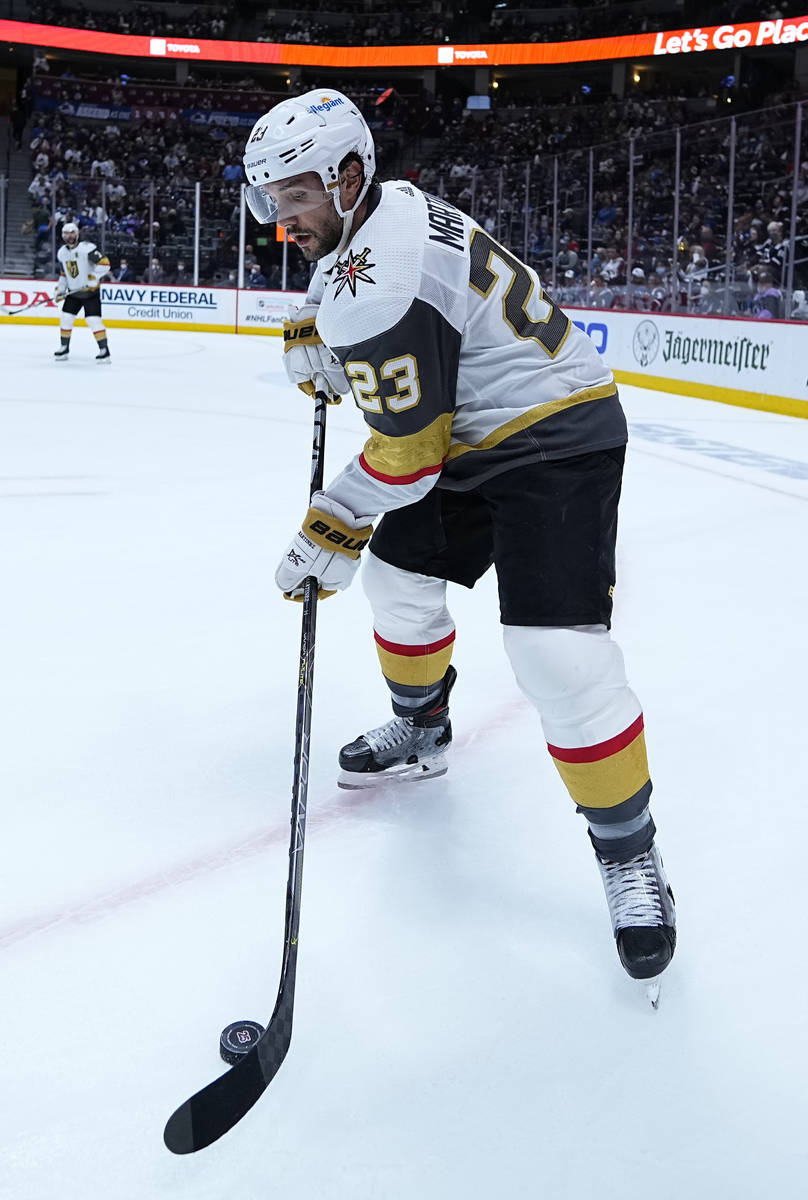 Vegas Golden Knights defenseman Alec Martinez (23) moves the puck against the Colorado Avalanch ...