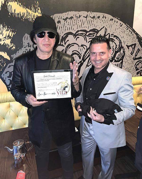 Gene Simmons, left, and Bella Vita of Henderson owner Sergio Montegrande are show with Simmons' ...