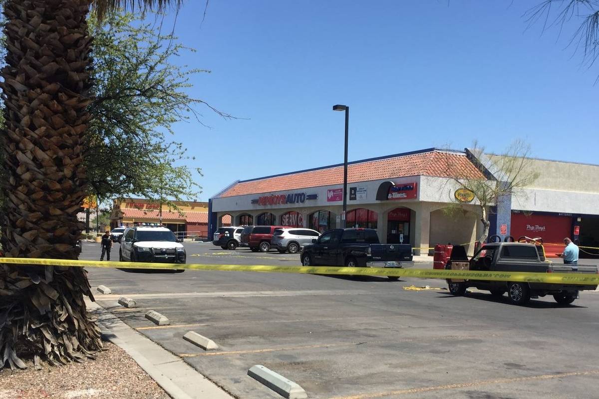 Police investigate the scene of a homicide in the 3900 block of East Charleston Boulevard in La ...