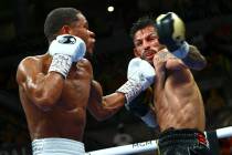 Devin Haney, left, punches Jorge Linares during the WBC lightweight title boxing match Saturday ...
