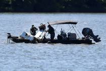 Emergency personnel remove debris from a plane crash in Percy Priest Lake Sunday, May 30, 2021, ...