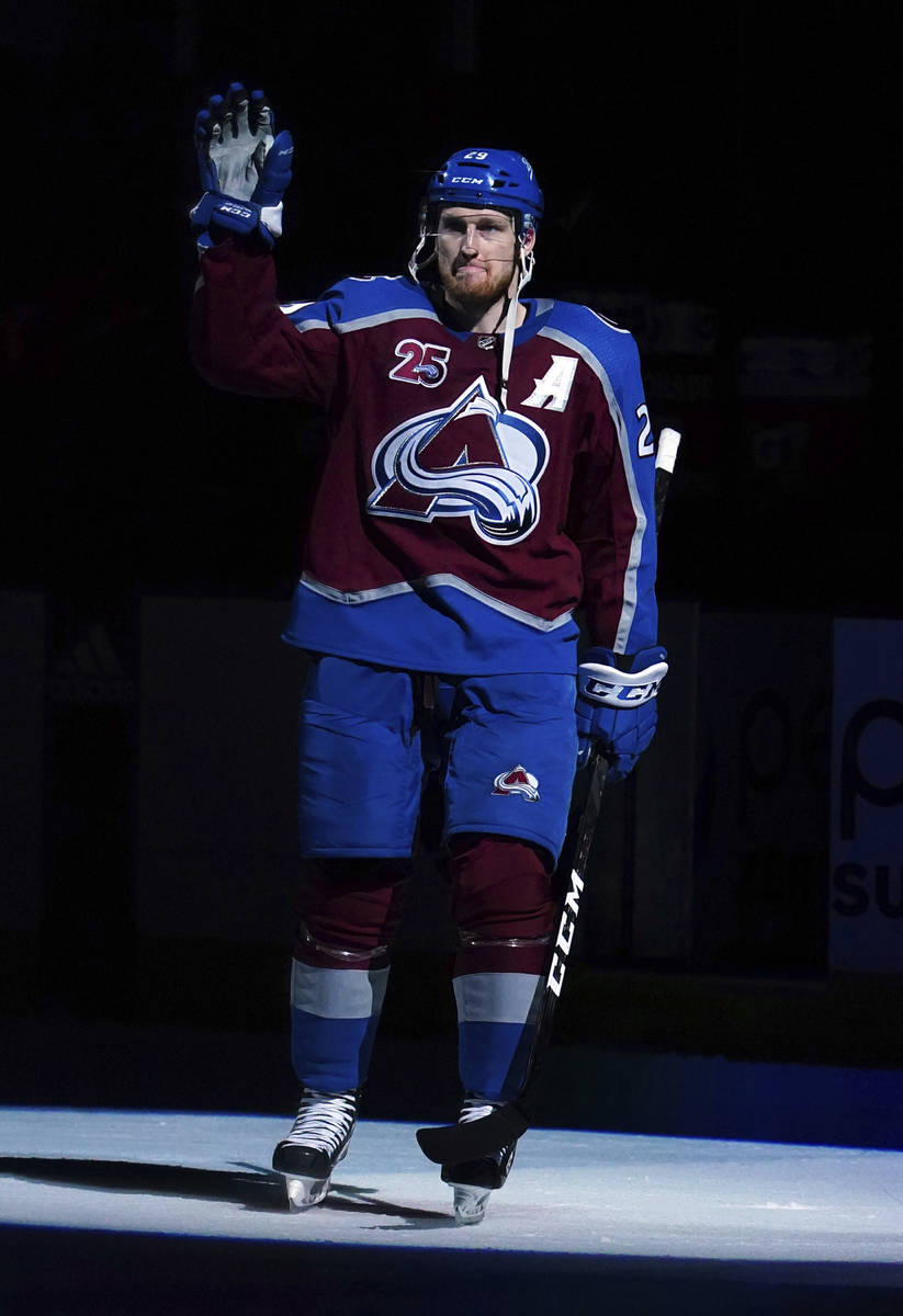 Colorado Avalanche center Nathan MacKinnon (29) waves to the crowd following a win against the ...
