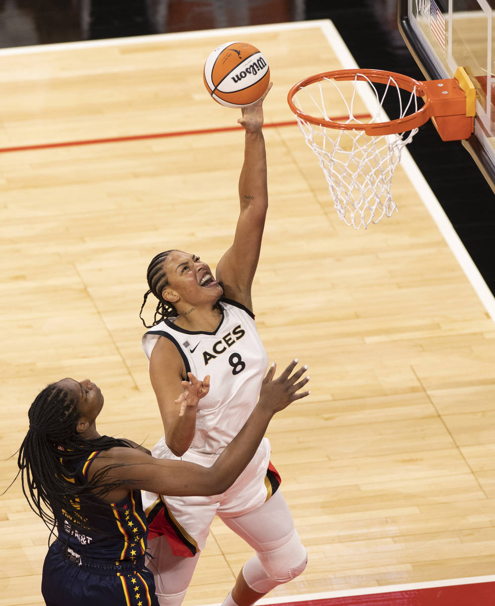 Las Vegas Aces center Liz Cambage (8) drives past Indiana Fever forward Teaira McCowan (15) in ...