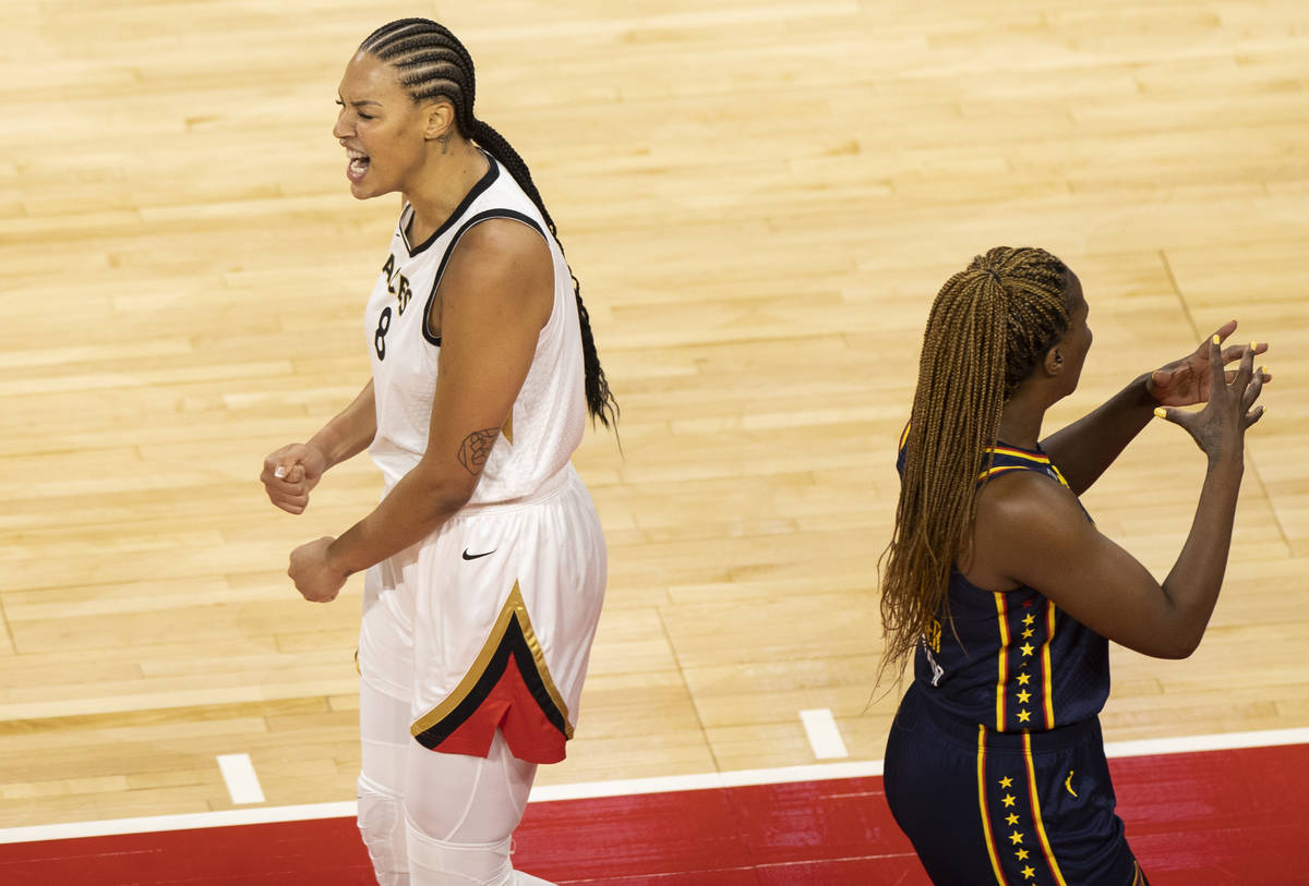 Las Vegas Aces center Liz Cambage (8) celebrates in front of Indiana Fever forward Jantel Laven ...