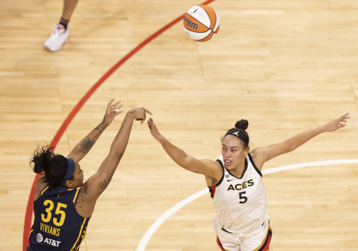 Las Vegas Aces forward Dearica Hamby (5) attempts to block the shot of Indiana Indiana Fever gu ...