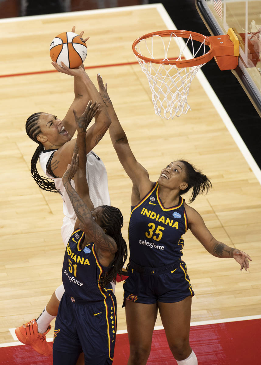 Las Vegas Aces center Liz Cambage (8) shoots over Indiana Fever forward Jessica Breland (51) an ...