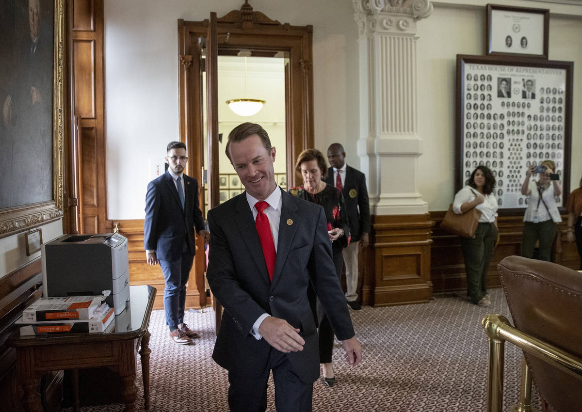 House Speaker Dade Phelan, R-Beaumont, emerges from a closed-door meeting with Democratic membe ...
