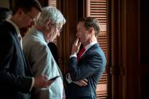 House Speaker Dade Phelan, R-Beaumont, right, talks to Republican members of the Texas House be ...