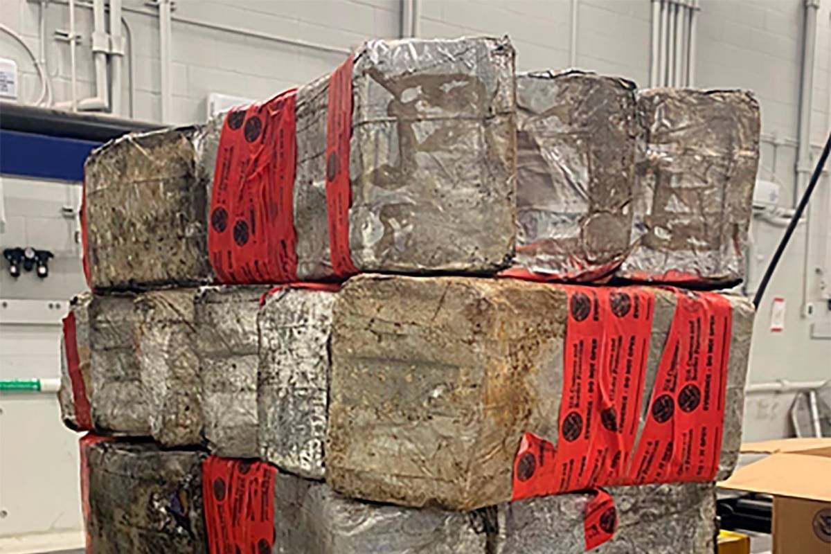 This photo shows seized drug bundles containing 132 pounds of methamphetamine on display from F ...