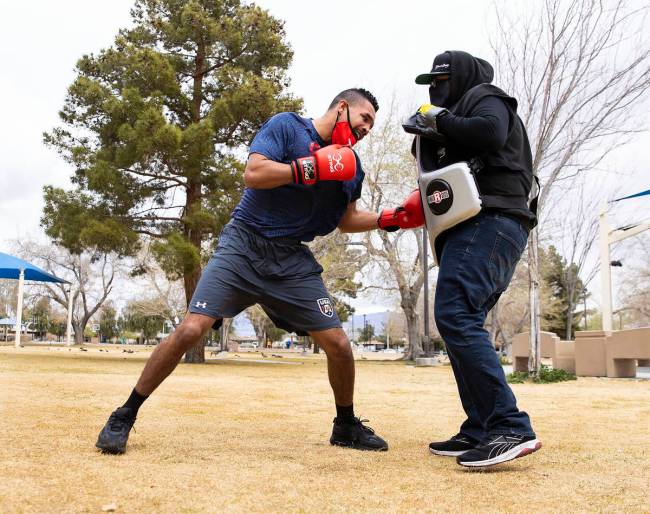 Rahim Gonzales, trains with his trainer Tyrone Herbert at Lorenzi Park, on Tuesday, March 9, 20 ...