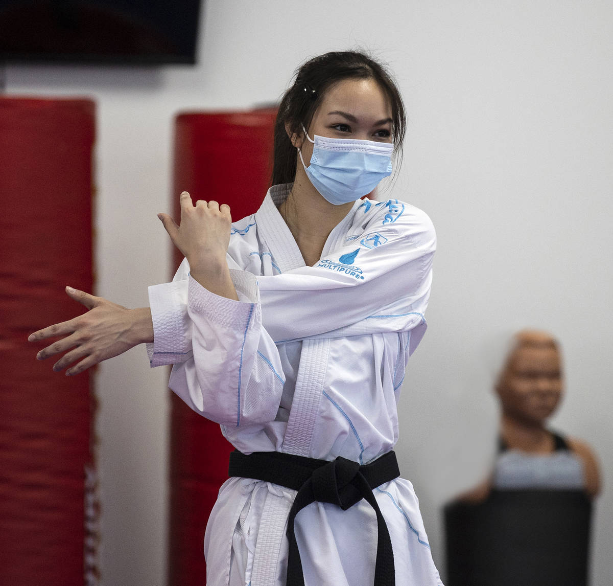 Trinity Allen stretches at her father karate studio. Allen is preparing to qualify for the U.S. ...