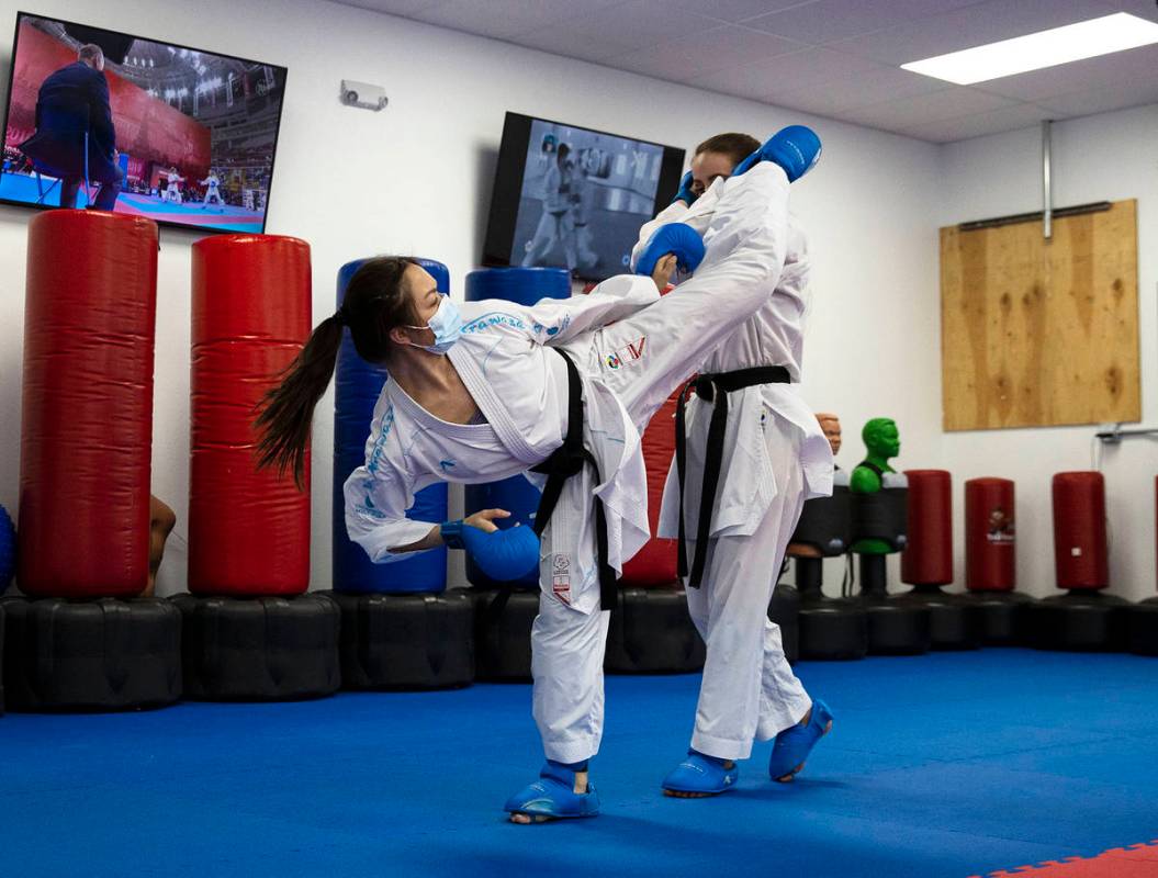 Trinity Allen, 20, left, trains at her father's karate studio. (Bizuayehu Tesfaye)