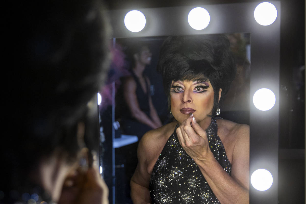 Edie puts the finishing touches on her makeup in the dressing room before another "Faaabul ...
