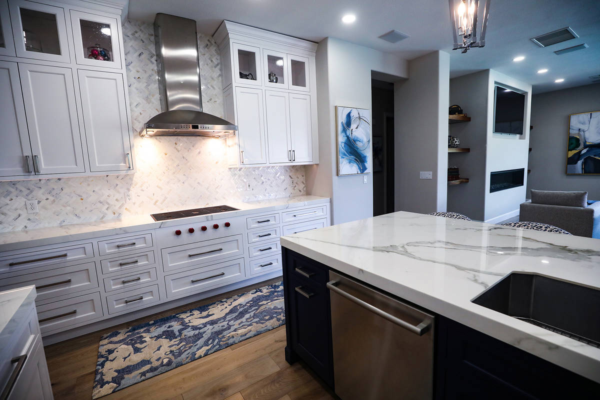 Use lightly veined quartz for counters paired with a pearly backsplash. (Rachel Aston)