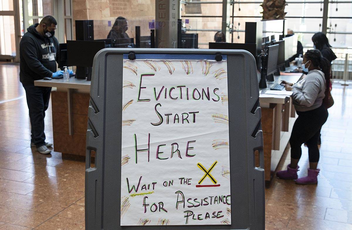 Tenants who received an eviction notice from their landlord fill out forms at the Civil Law Sel ...