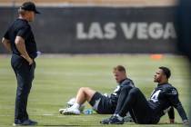 Head Coach Jon Gruden talks with safety Johnathan Abram (24) during a Las Vegas Raiders open pr ...