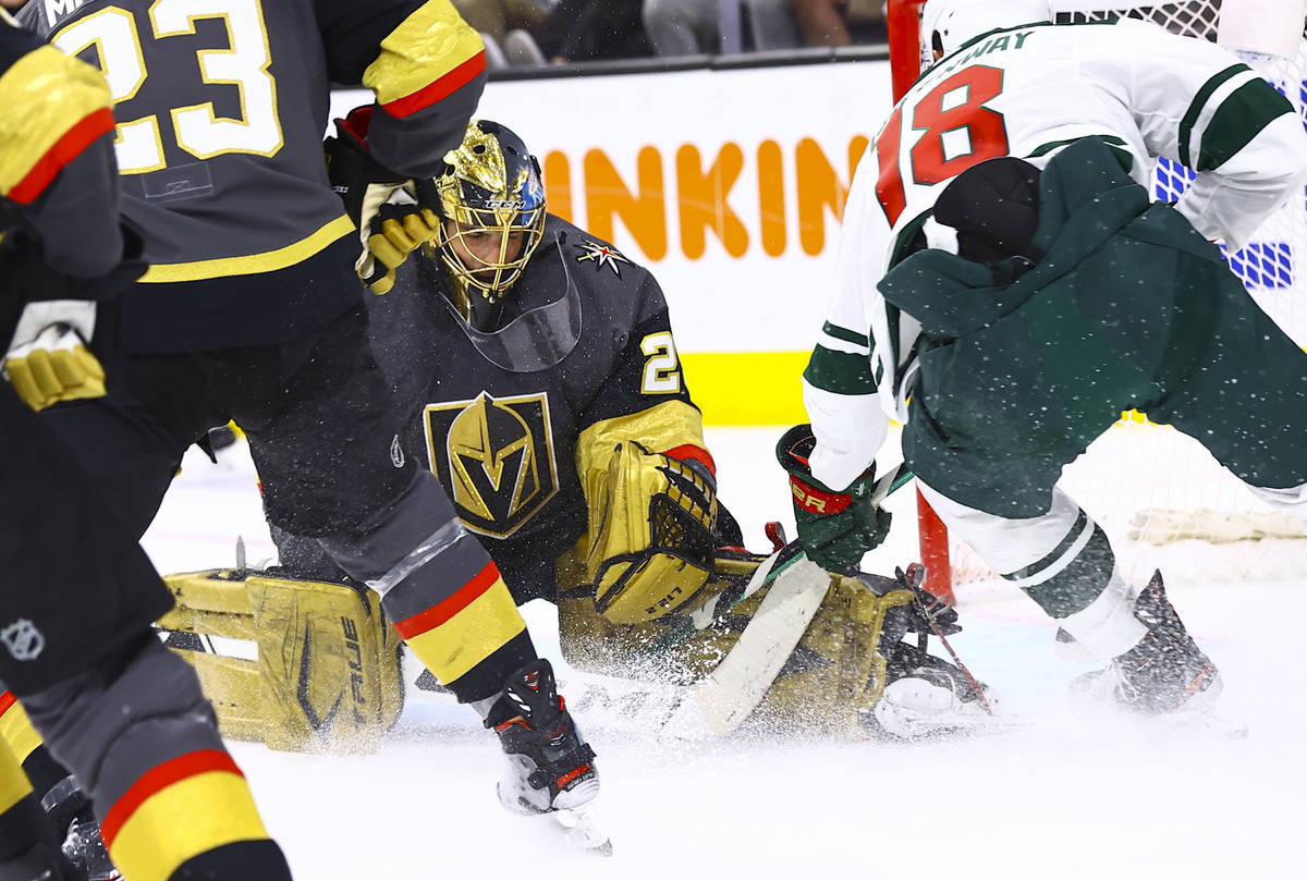 Golden Knights goaltender Marc-Andre Fleury (29) attempts to make a save against Minnesota Wild ...