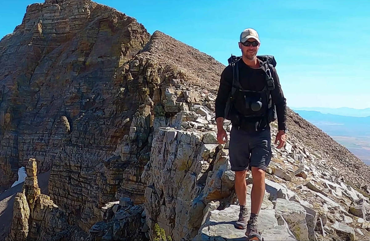In this image from video, Eric Poulin hikes along a new route he christened the "Basin and Rang ...