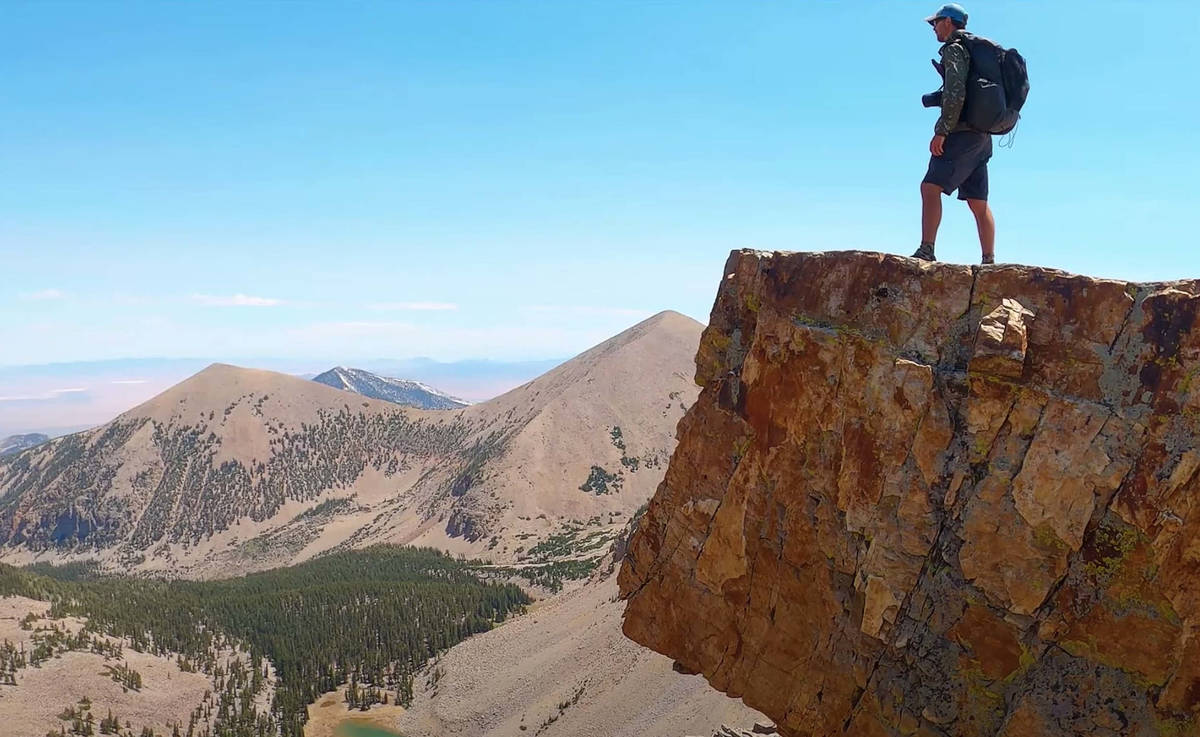 In this image from video, Eric Poulin hikes along a new route he christened the "Basin and Rang ...