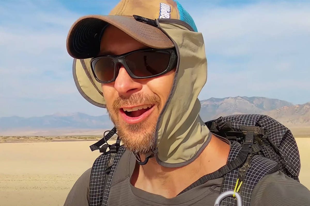 In this image from video, Eric Poulin hikes along a new route he christened the "Basin and Rang ...