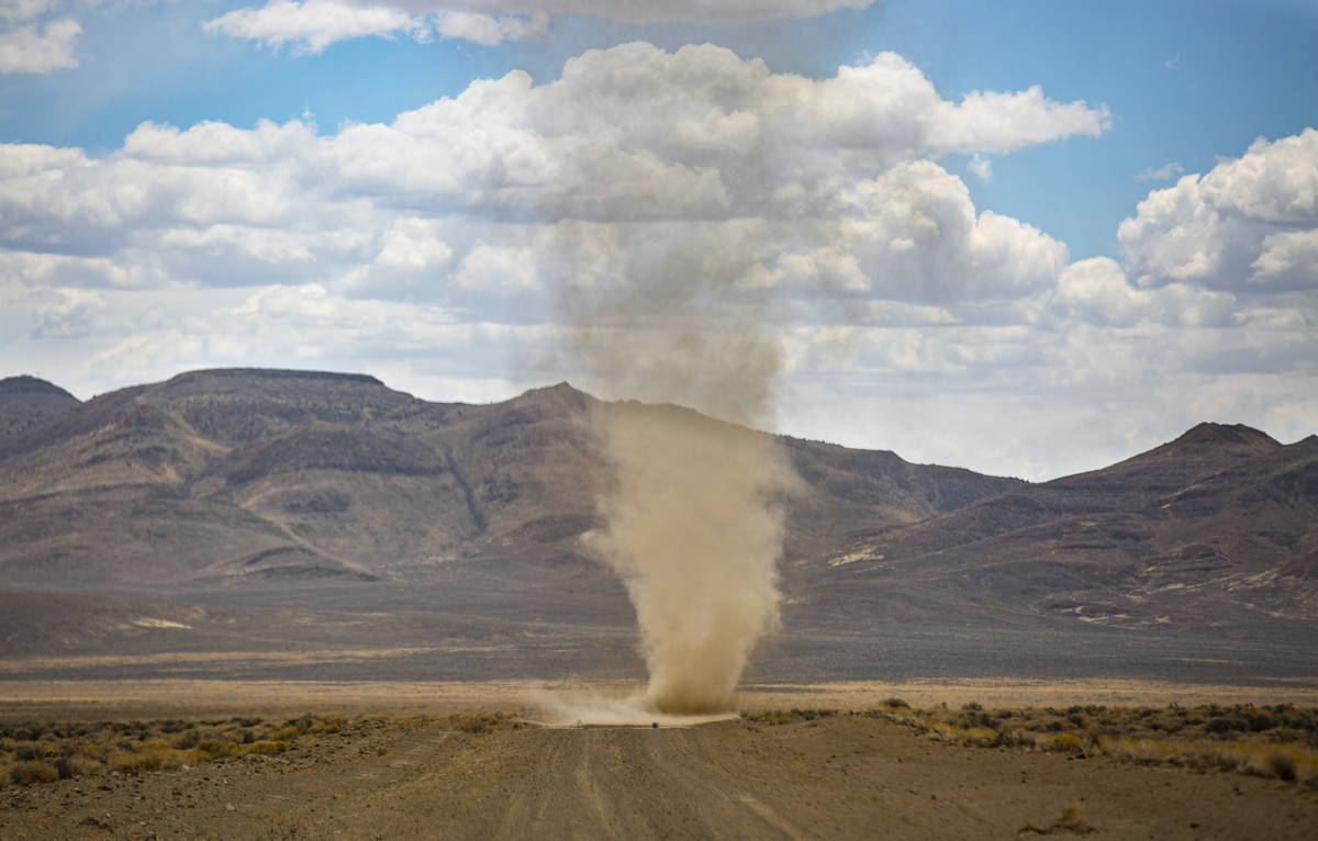 A dust devil moves around a dirt road in the Hot Creek Range along the Basin & Range trail ...