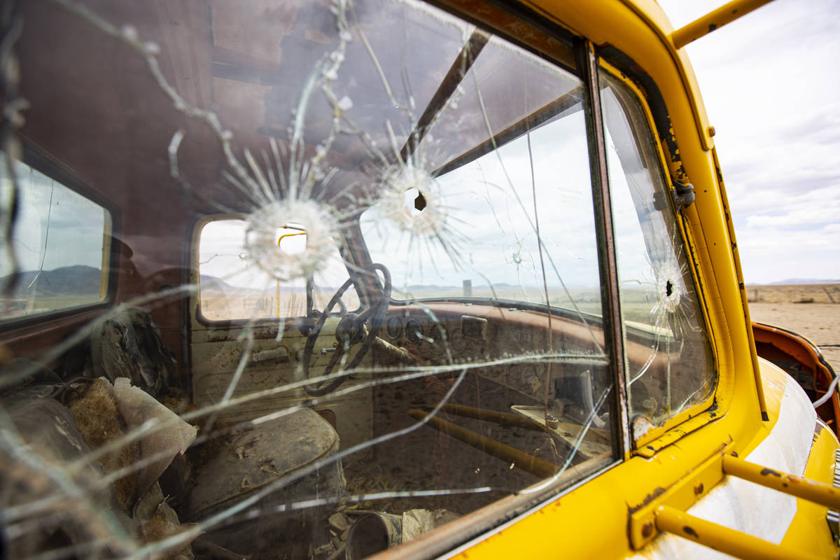 Bullet holes are seen in the windows of an abandoned 1950s International R190 truck in the Hot ...