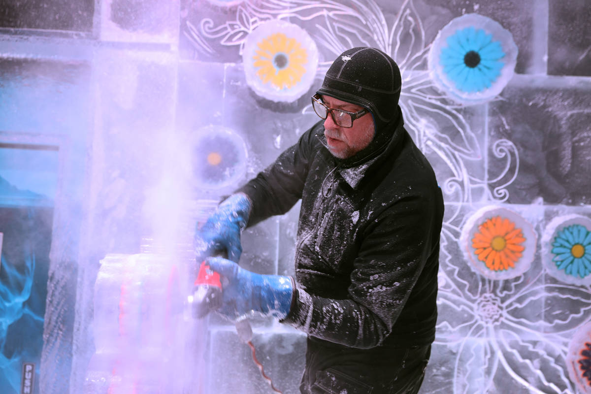 Ice artist Peter Slavin carves a design on a wall at the Icebar at the LINQ Promenade in Las Ve ...