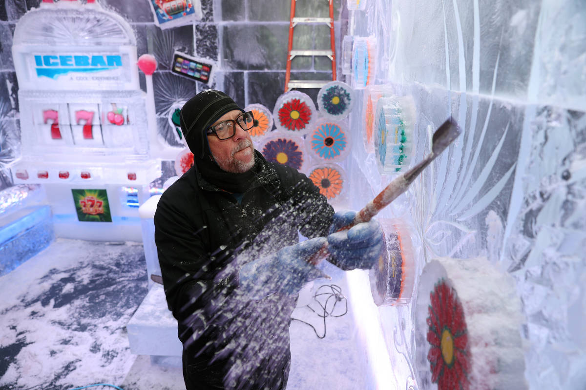 Ice artist Peter Slavin carves a design on a wall at the Icebar at the LINQ Promenade in Las Ve ...