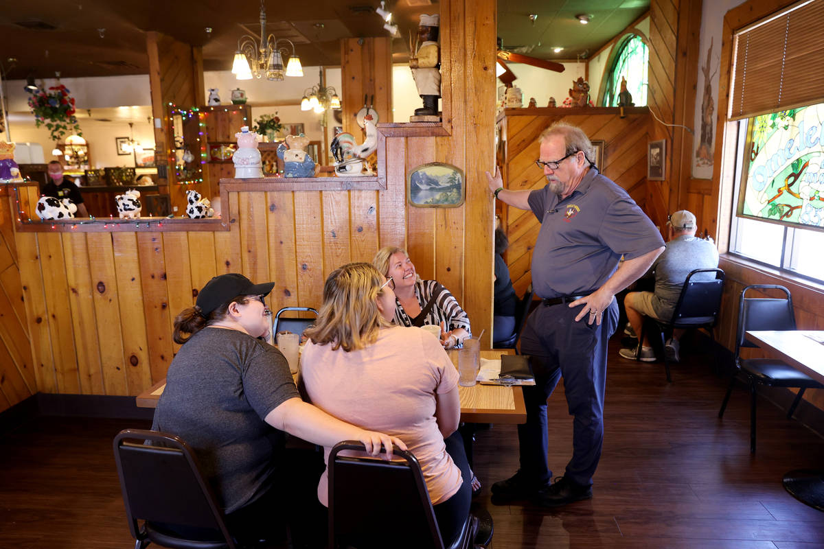 Omelet House owner Kevin Mills talks to long-time customers, from left, Shaye Morrison, Kara Do ...