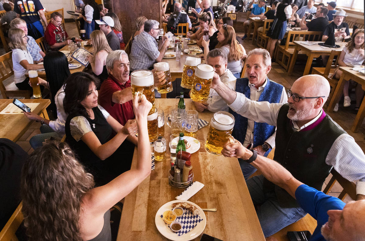 Guests raise their beer mugs for a cheers during the grand reopening of Hofbrauhaus Las Vegas o ...