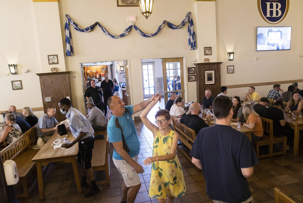 Iulian Constantin, left, and Maria Petrache dance during the grand reopening of Hofbrauhaus Las ...