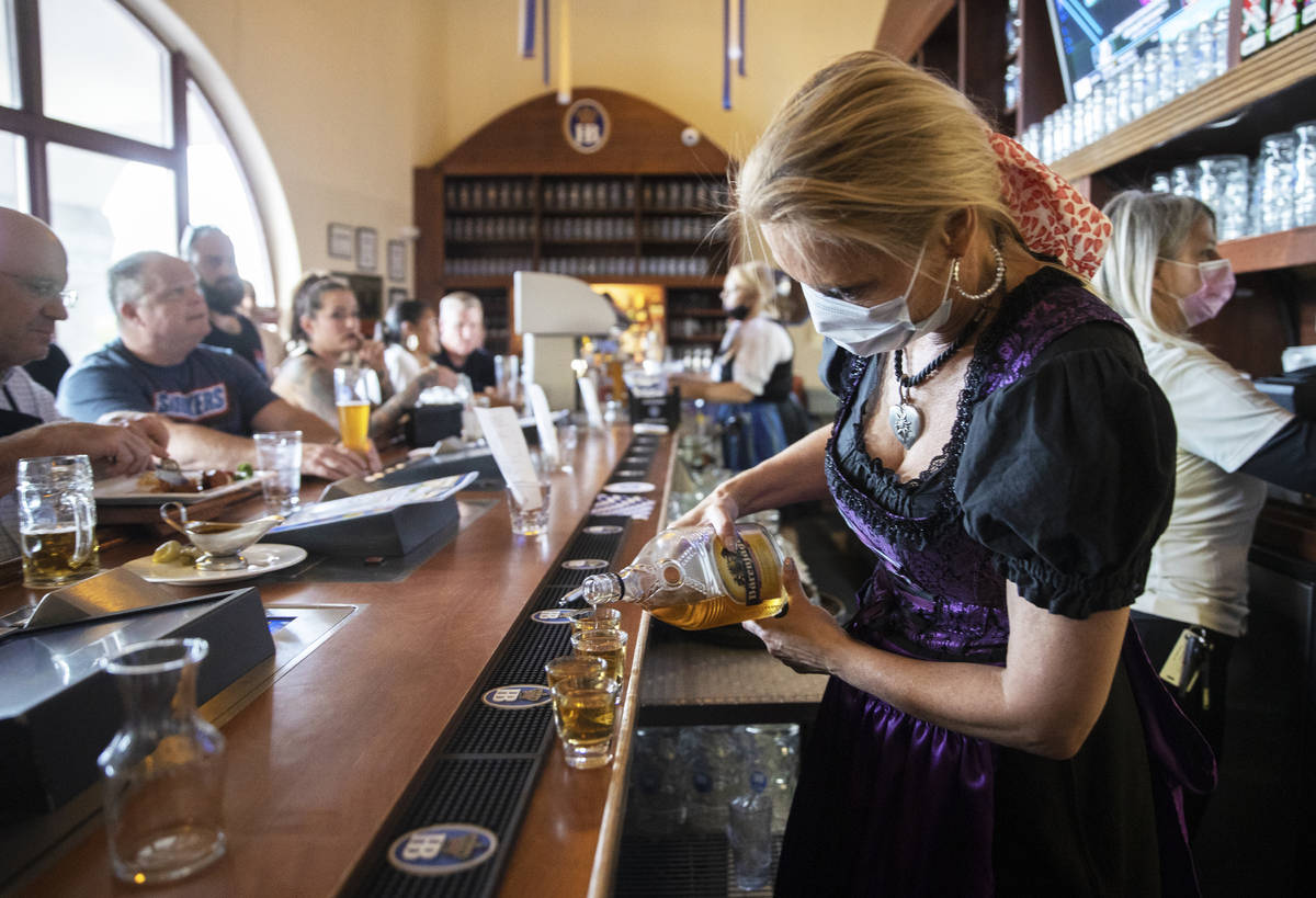 Shots are poured at the bar during the grand reopening of Hofbrauhaus Las Vegas on Tuesday, Jun ...