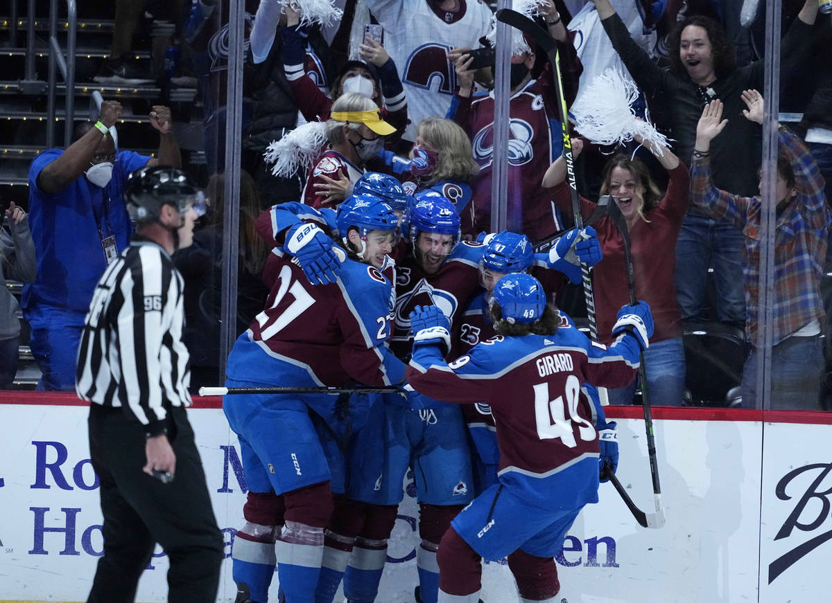 Colorado Avalanche left wing Brandon Saad (20) is congratulated by teammates after his goal aga ...