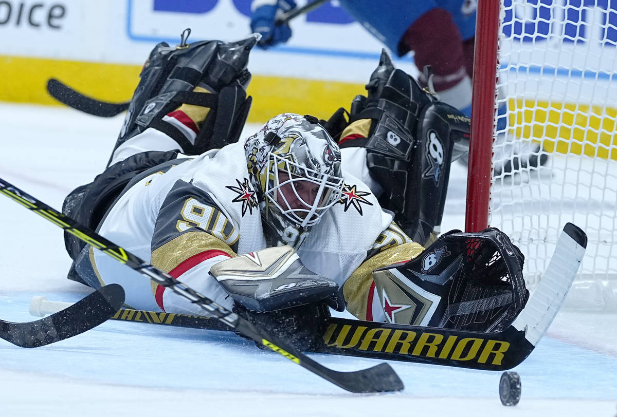 Vegas Golden Knights goaltender Robin Lehner (90) dives for a puck against the Colorado Avalanc ...