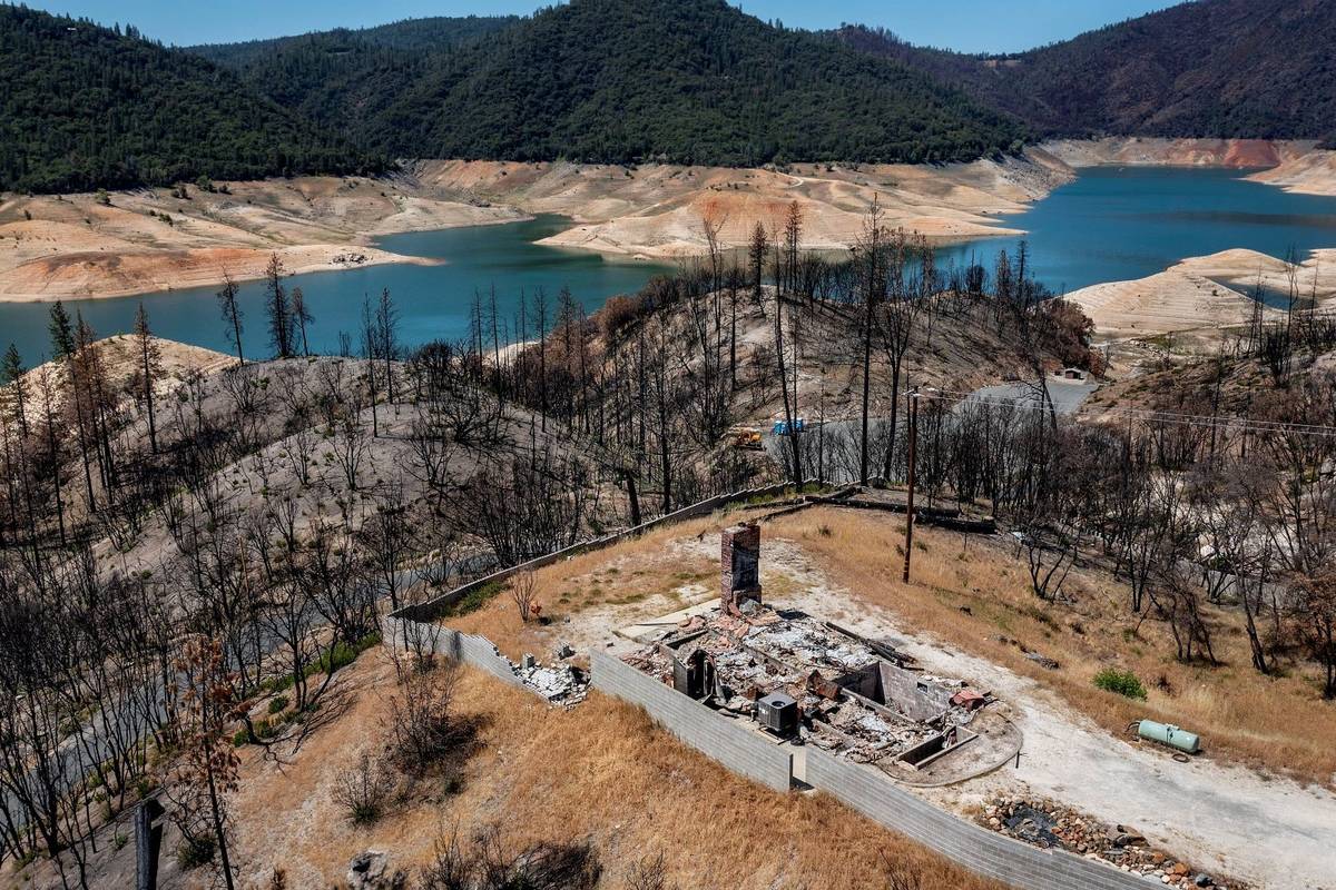 A home destroyed in the 2020 North Complex Fire sits above Lake Oroville on Sunday, May 23, 202 ...
